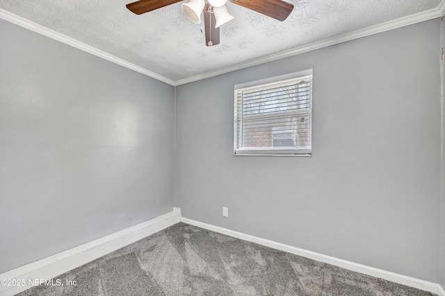 unfurnished room with ornamental molding, baseboards, carpet floors, and a textured ceiling