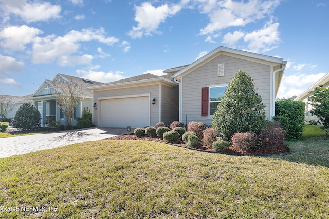 view of front facade with a front yard, an attached garage, and driveway