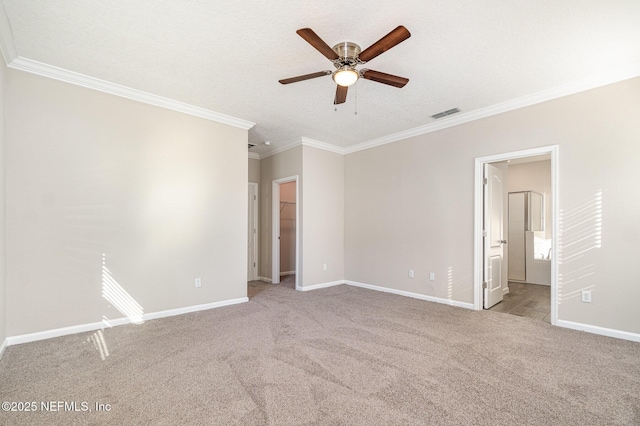 spare room featuring visible vents, baseboards, and carpet floors