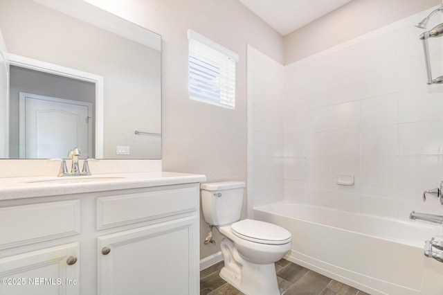 bathroom with vanity, toilet, wood finished floors, and tub / shower combination