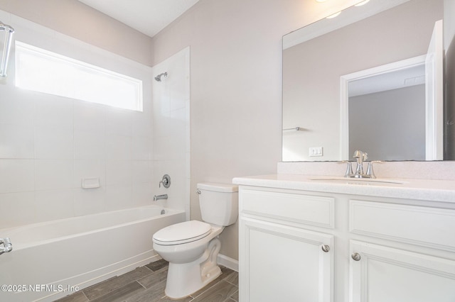 bathroom featuring vanity, bathing tub / shower combination, toilet, and wood tiled floor