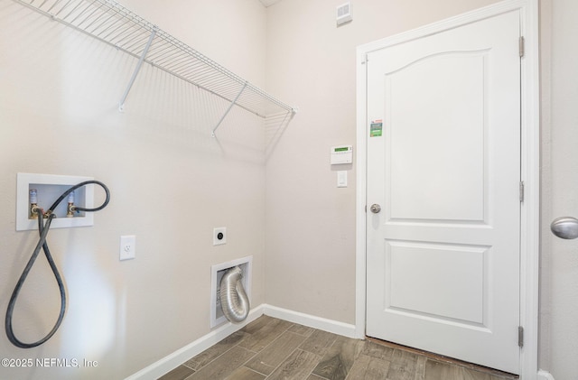 clothes washing area with wood finished floors, baseboards, hookup for an electric dryer, laundry area, and washer hookup