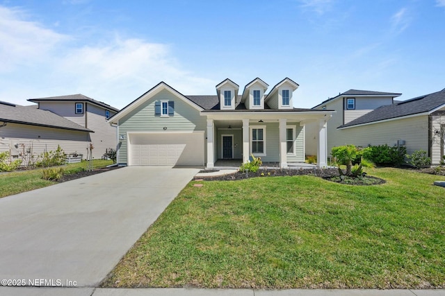 cape cod home featuring a garage, covered porch, concrete driveway, and a front yard