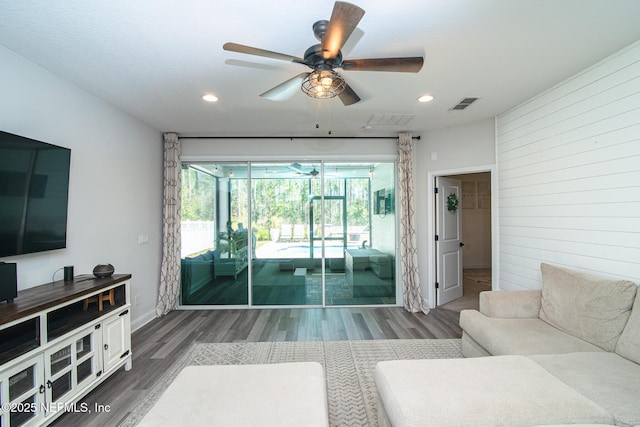 living room featuring visible vents, ceiling fan, a sunroom, recessed lighting, and wood finished floors