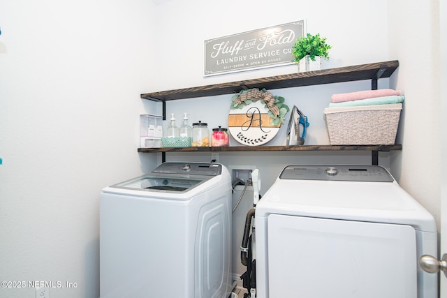 washroom with washer and dryer and laundry area