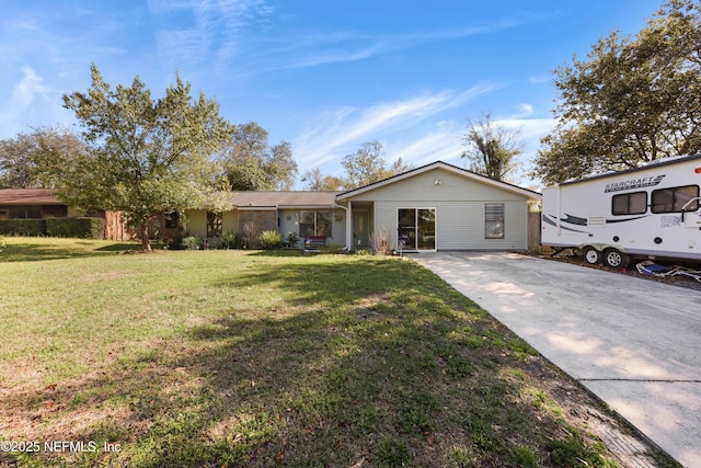 ranch-style home with a front yard and driveway