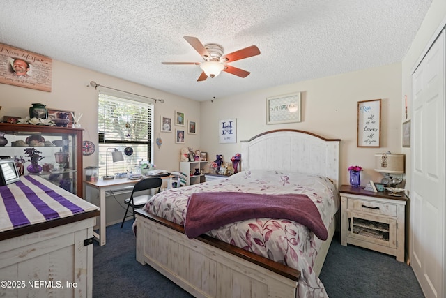 bedroom featuring dark colored carpet, a textured ceiling, and a ceiling fan