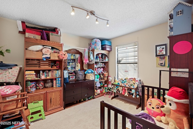 carpeted bedroom featuring a textured ceiling