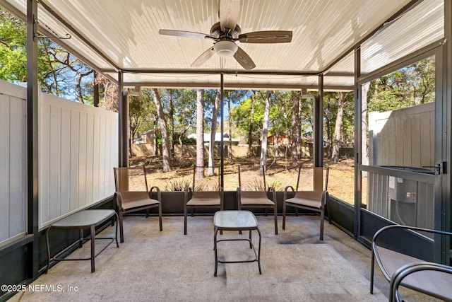 sunroom with a wealth of natural light, wooden ceiling, and a ceiling fan