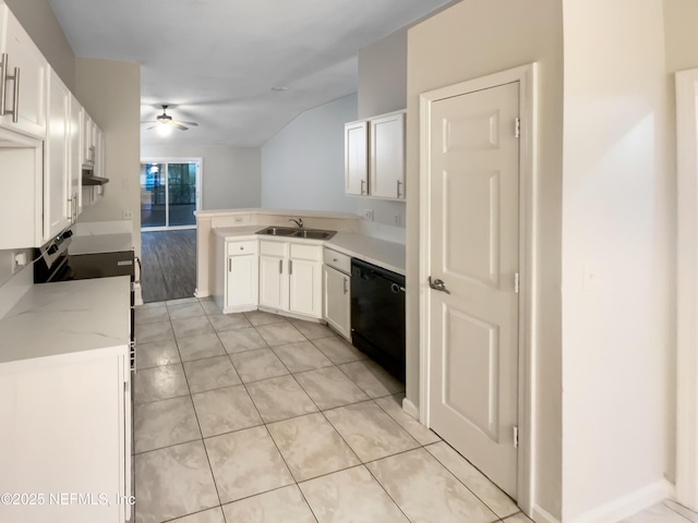 kitchen featuring a peninsula, white cabinetry, black dishwasher, and a sink