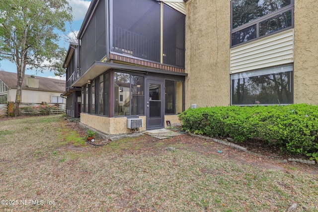 5400 La Moya Ave Unit 16, Jacksonville, FL 32210 - back of house with a sunroom and stucco siding