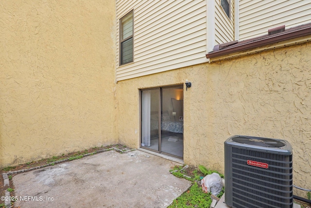 5400 La Moya Ave Unit 16, Jacksonville, FL 32210 - property entrance featuring central air condition unit, a patio area, and stucco siding