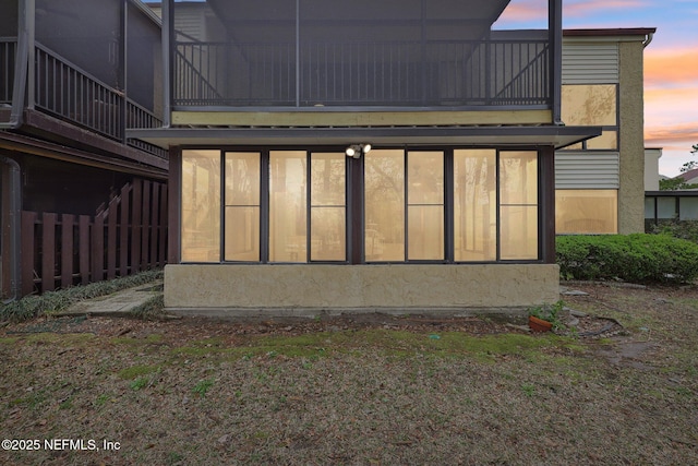 5400 La Moya Ave Unit 16, Jacksonville, FL 32210 - back of house at dusk featuring a balcony