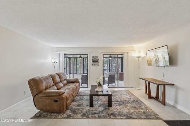 5400 La Moya Ave Unit 16, Jacksonville, FL 32210 - living area featuring a textured ceiling and baseboards
