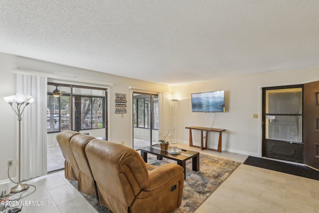 5400 La Moya Ave Unit 16, Jacksonville, FL 32210 - living area featuring baseboards and a textured ceiling