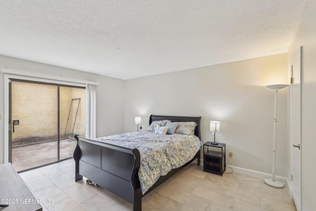 5400 La Moya Ave Unit 16, Jacksonville, FL 32210 - bedroom featuring access to outside, baseboards, and a textured ceiling