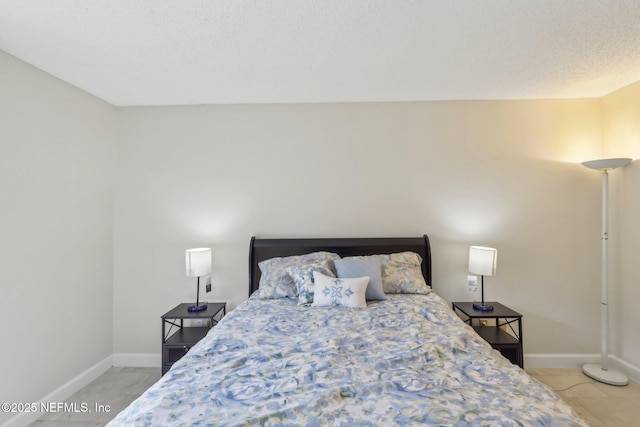5400 La Moya Ave Unit 16, Jacksonville, FL 32210 - bedroom with light tile patterned floors and baseboards