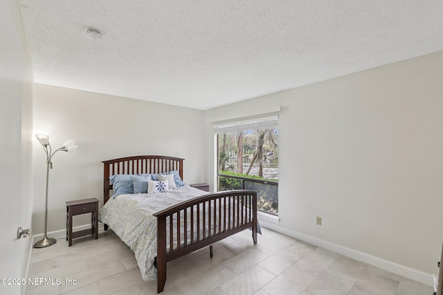 5400 La Moya Ave Unit 16, Jacksonville, FL 32210 - bedroom with baseboards and a textured ceiling