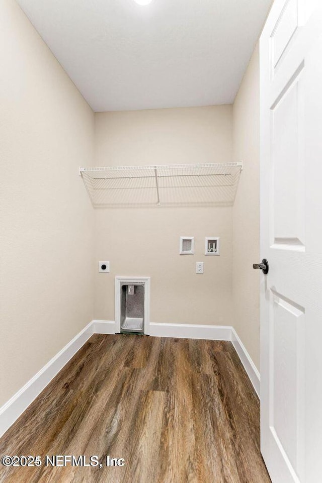 laundry area featuring hookup for a washing machine, wood finished floors, baseboards, laundry area, and electric dryer hookup