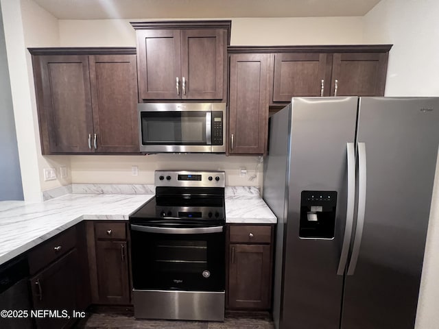 kitchen with stainless steel appliances and dark brown cabinets