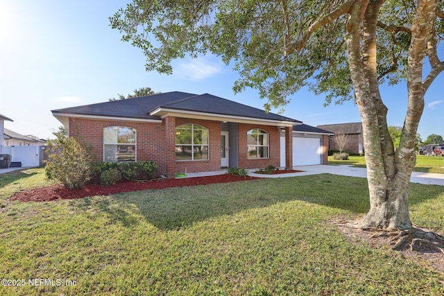 2721 Ridge Haven Dr, Green Cove Springs, FL 32043 - ranch-style home featuring driveway, a front yard, an attached garage, and brick siding