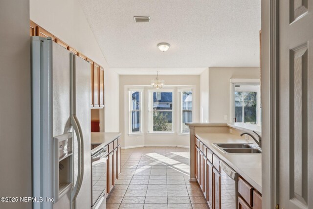2721 Ridge Haven Dr, Green Cove Springs, FL 32043 - kitchen with a sink, white fridge with ice dispenser, dishwasher, visible vents, and electric range