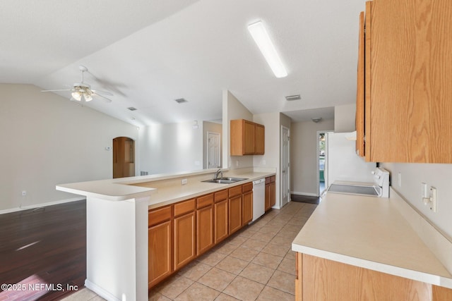 2721 Ridge Haven Dr, Green Cove Springs, FL 32043 - kitchen featuring vaulted ceiling, white appliances, a sink, a ceiling fan, and a peninsula