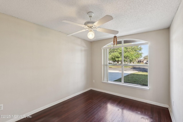 2721 Ridge Haven Dr, Green Cove Springs, FL 32043 - spare room featuring baseboards, a textured ceiling, ceiling fan, and dark wood finished floors