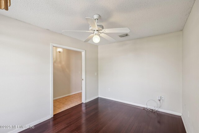 2721 Ridge Haven Dr, Green Cove Springs, FL 32043 - spare room featuring baseboards, a textured ceiling, ceiling fan, visible vents, and wood finished floors