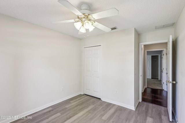 2721 Ridge Haven Dr, Green Cove Springs, FL 32043 - unfurnished bedroom featuring a closet, baseboards, visible vents, and light wood finished floors