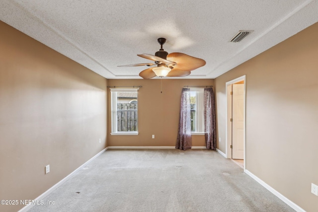 2721 Ridge Haven Dr, Green Cove Springs, FL 32043 - carpeted empty room with baseboards, visible vents, ceiling fan, and a textured ceiling
