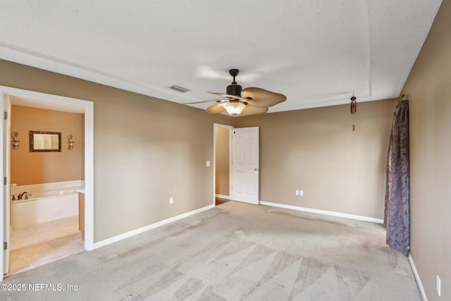 2721 Ridge Haven Dr, Green Cove Springs, FL 32043 - unfurnished bedroom with carpet floors, baseboards, visible vents, and a textured ceiling