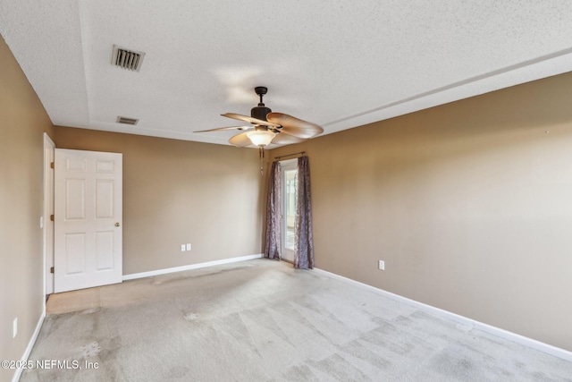 2721 Ridge Haven Dr, Green Cove Springs, FL 32043 - carpeted empty room with a textured ceiling, visible vents, baseboards, and a ceiling fan