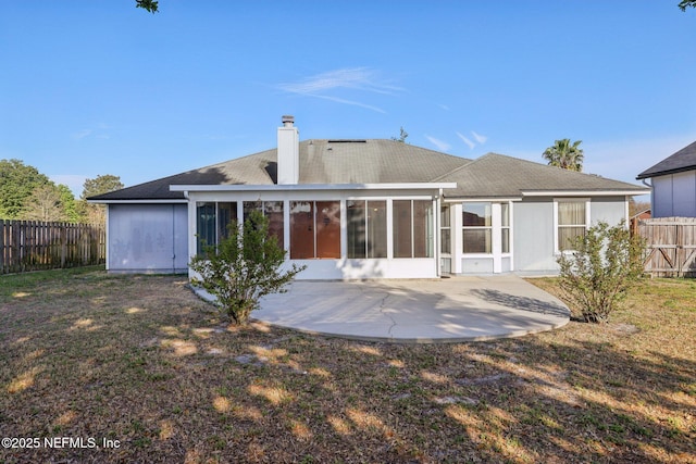 2721 Ridge Haven Dr, Green Cove Springs, FL 32043 - rear view of property with a sunroom, a chimney, fence private yard, and a patio area