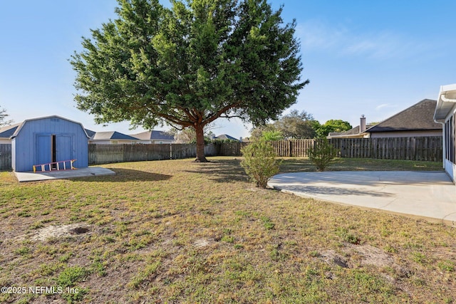 2721 Ridge Haven Dr, Green Cove Springs, FL 32043 - view of yard featuring a patio, a storage unit, a fenced backyard, and an outdoor structure