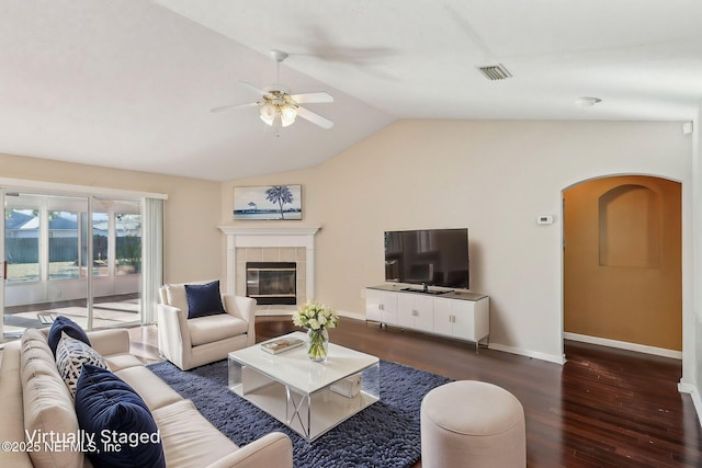 2721 Ridge Haven Dr, Green Cove Springs, FL 32043 - living room with vaulted ceiling, arched walkways, visible vents, a ceiling fan, and wood finished floors