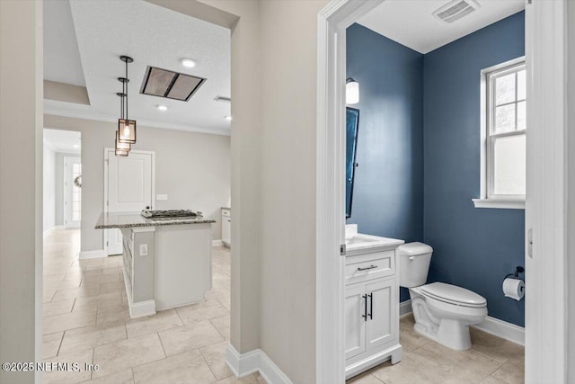 bathroom with tile patterned flooring, visible vents, baseboards, toilet, and vanity