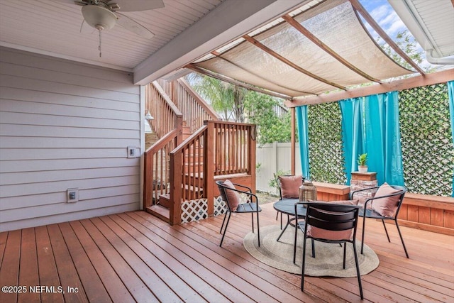 wooden deck featuring a pergola, stairs, and ceiling fan