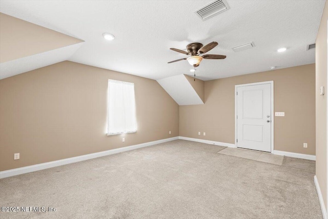 bonus room with visible vents, ceiling fan, baseboards, carpet, and vaulted ceiling