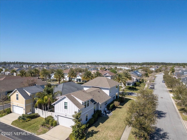 birds eye view of property with a residential view