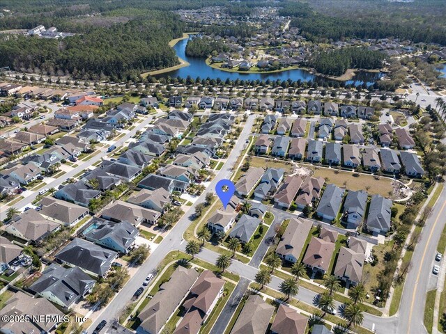 aerial view with a residential view and a water view