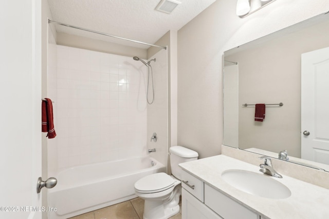 bathroom with vanity, visible vents, tile patterned flooring, a textured ceiling, and toilet