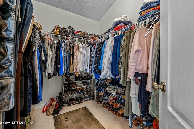 spacious closet with tile patterned flooring