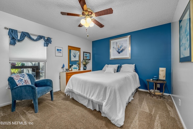 carpeted bedroom with baseboards, a textured ceiling, and ceiling fan