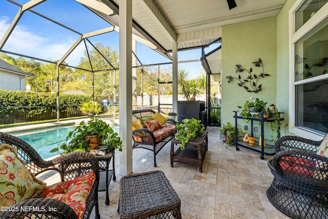 view of patio with an outdoor living space, a fenced in pool, a lanai, and fence