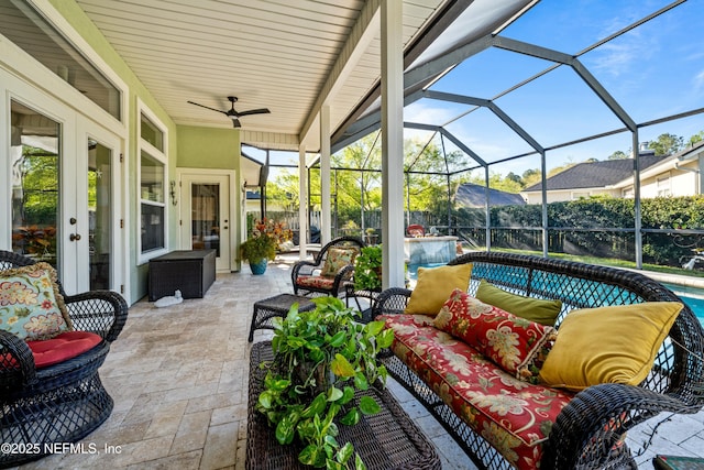 view of patio / terrace with an outdoor living space, an outdoor pool, glass enclosure, and a ceiling fan