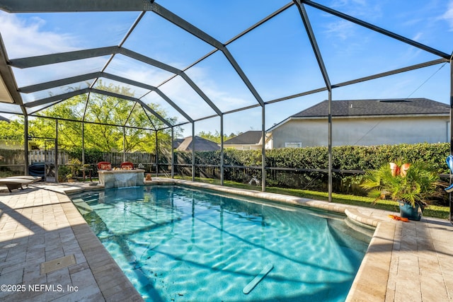 view of pool with a lanai, a fenced in pool, a fenced backyard, and a patio area