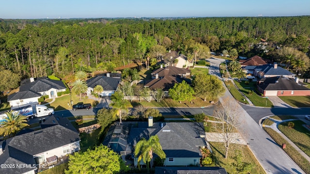 bird's eye view with a residential view and a wooded view