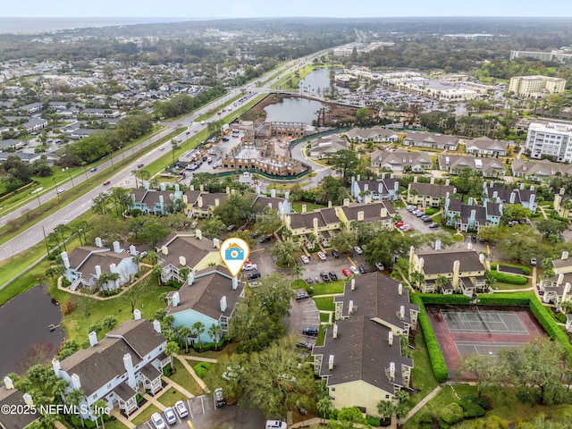 birds eye view of property with a water view and a residential view