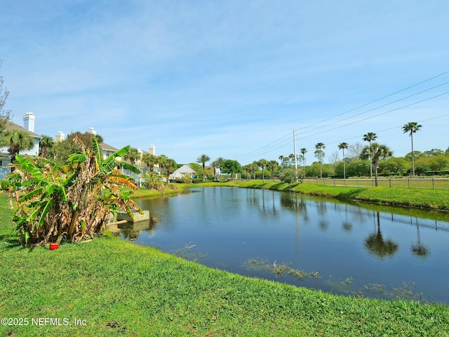 property view of water featuring fence